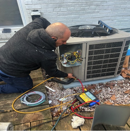 AC technician in MD fixing an AC unit